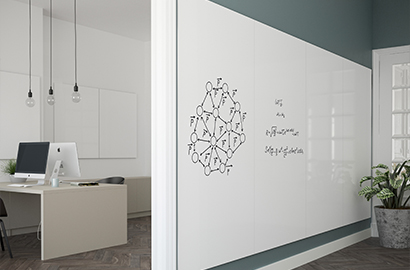 An office space with a Chameleon Sharp Wall whiteboard on the wall