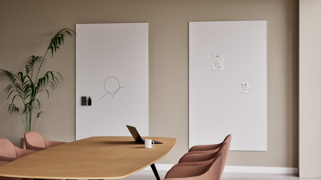 Frameless ceramic steel whiteboard mounted flush in a minimalist office