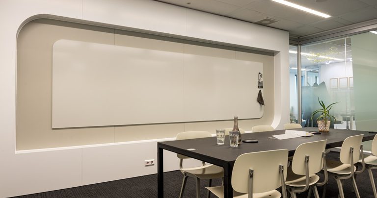 Close-up of a rounded bespoke whiteboard wall corner detail