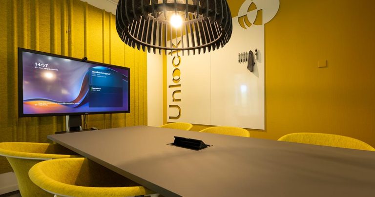 Custom skyline silhouette cut into a bespoke whiteboard wall on a yellow wall