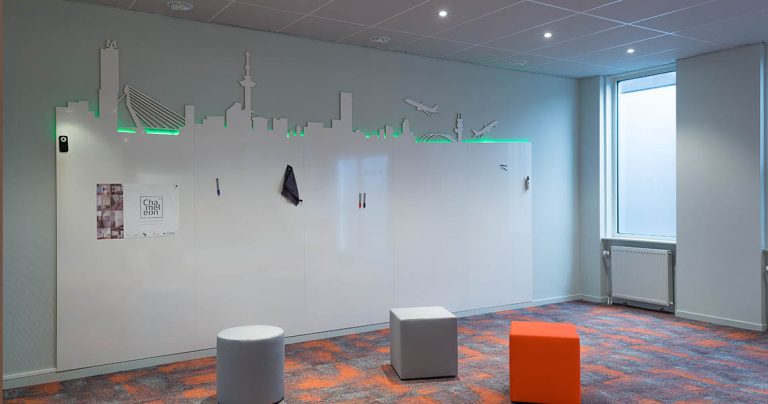 Bespoke whiteboard wall with an illuminated Rotterdam skyline cutout