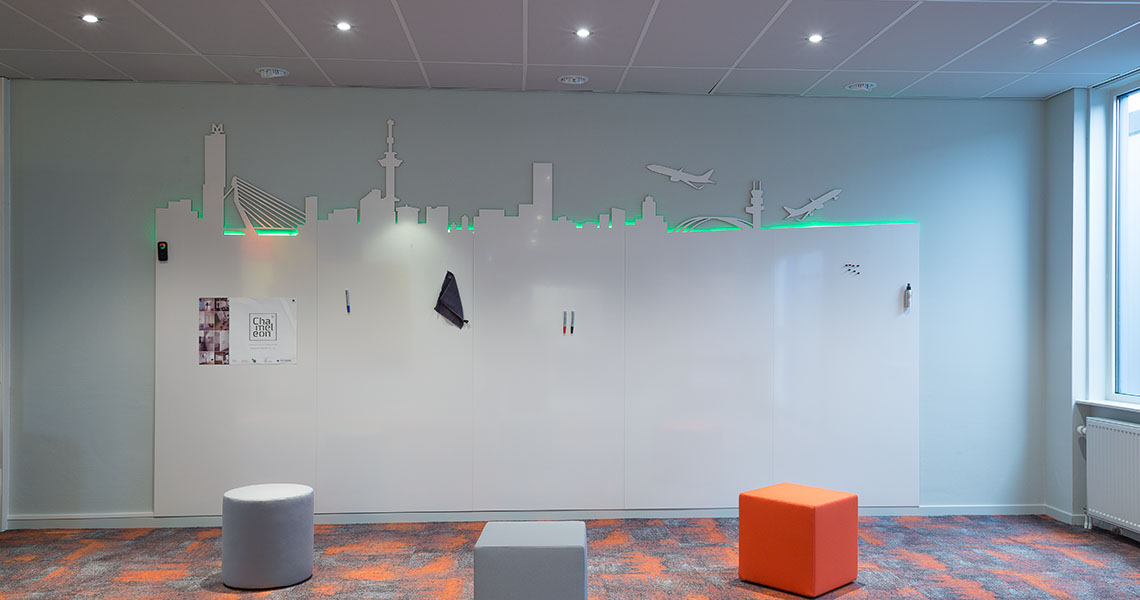 Bespoke whiteboard wall in a lounge-style workshop area