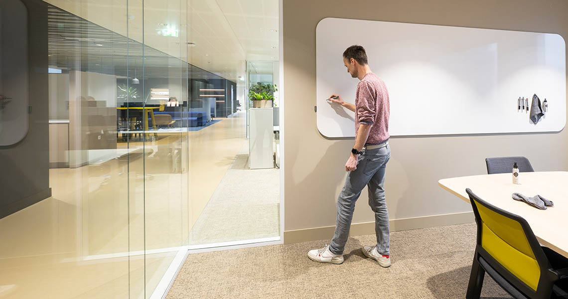 Ceramic steel whiteboard in a meeting room viewed from the side