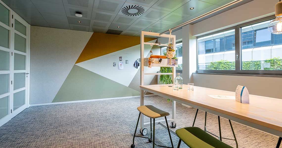 Empty custom whiteboard wall in a collaborative lounge area