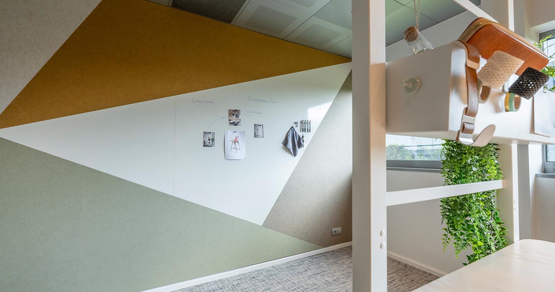 Custom whiteboard wall built into an angled office wall design