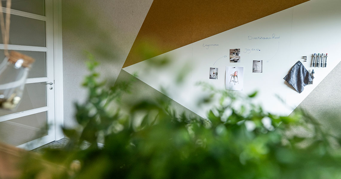 Custom whiteboard wall shown in an open office corner
