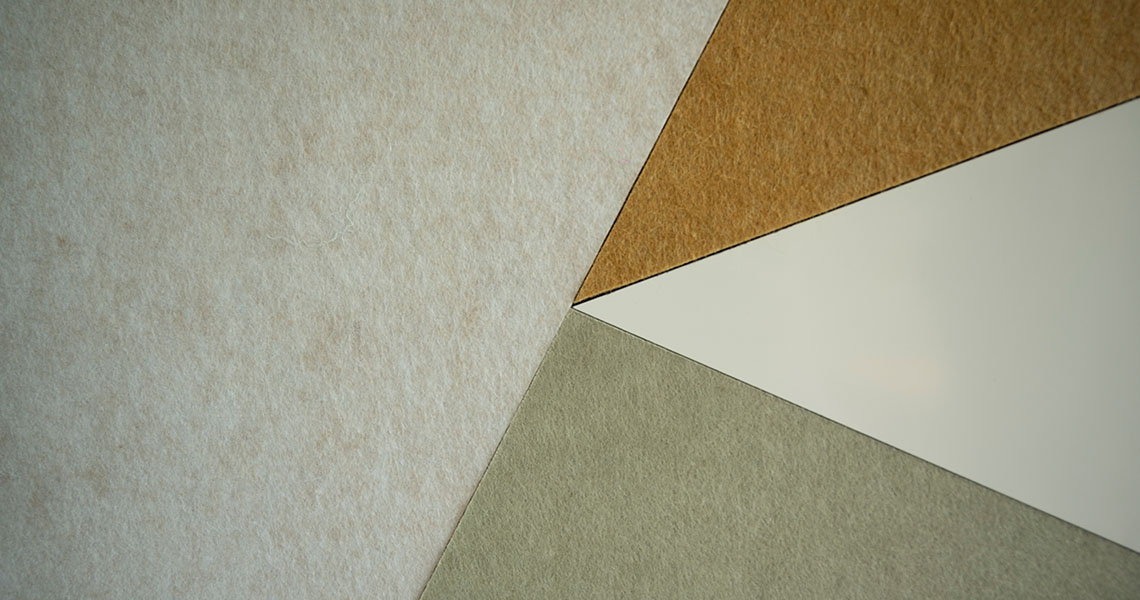 Close-up of layered acoustic and whiteboard material samples