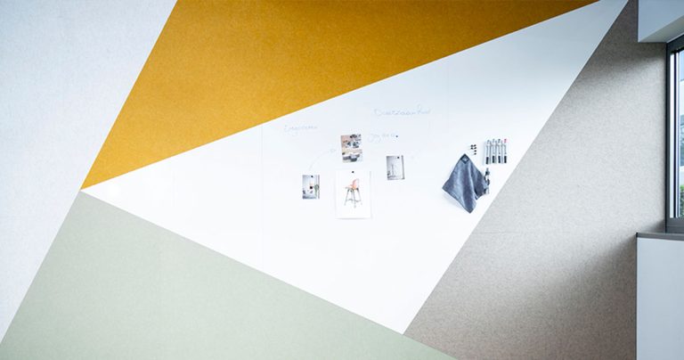 Custom whiteboard wall detail with geometric colour blocking