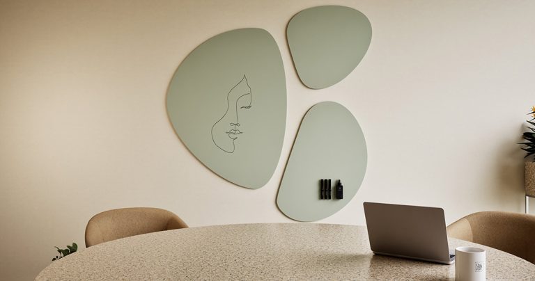 Design whiteboard positioned in an open-plan collaboration area