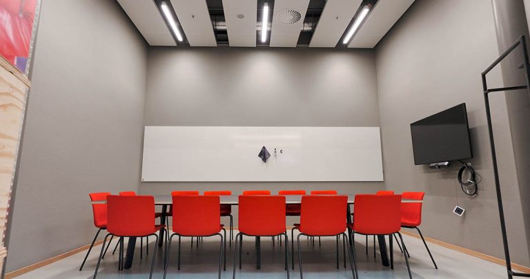 Design whiteboard positioned beside acoustic wall panels