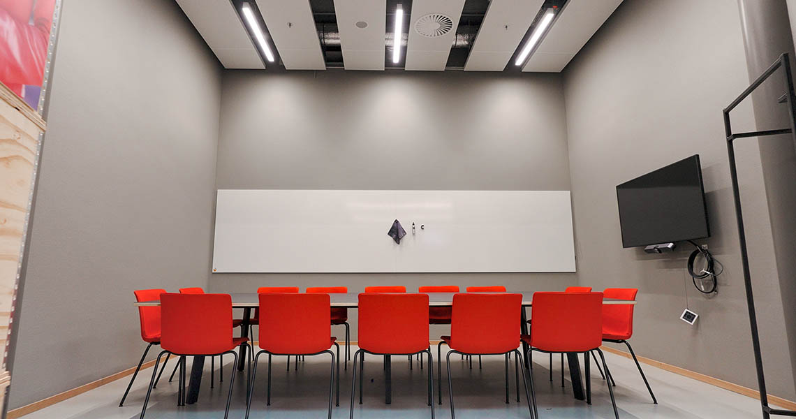 Design whiteboard positioned beside acoustic wall panels