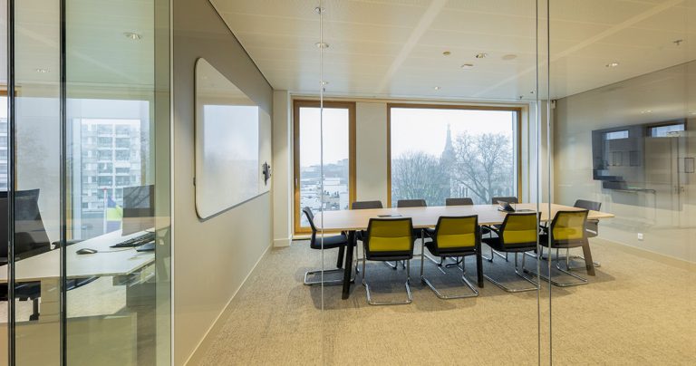 Frameless whiteboard surface showing the seamless edge against the wall