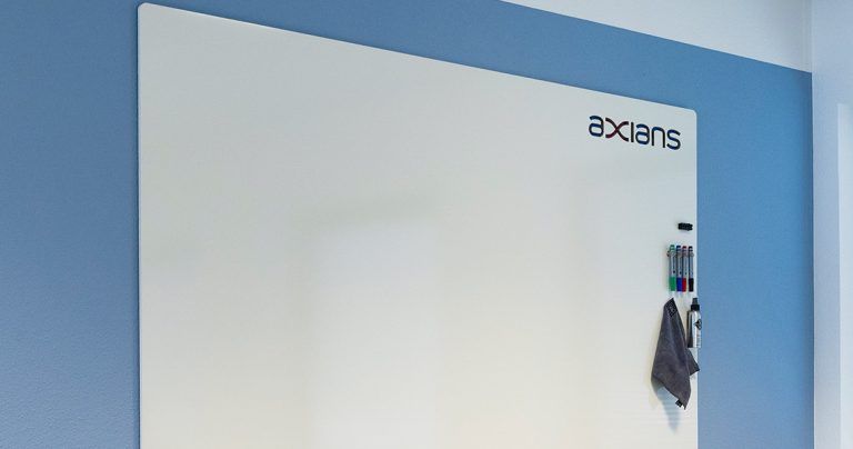 Close-up of a frameless whiteboard's sealed edge finish