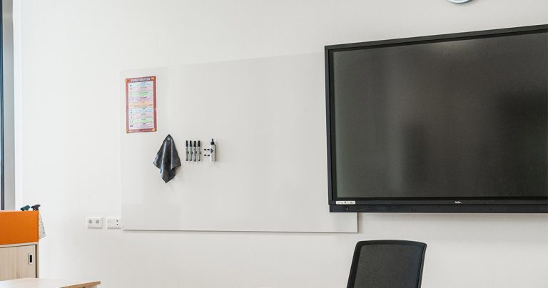 Large classroom whiteboard installed in a lecture hall or teaching space