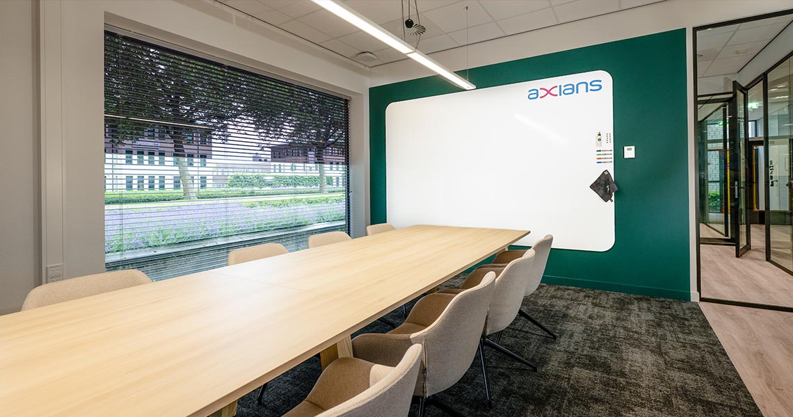 Whiteboard wall installed across an office wall