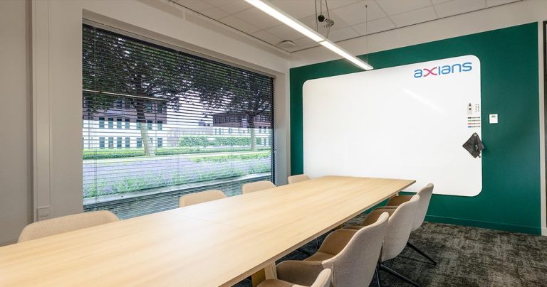 Whiteboard wall installed across an office wall