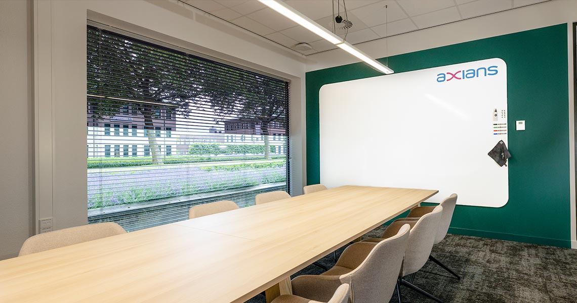 Whiteboard wall installed across an office wall