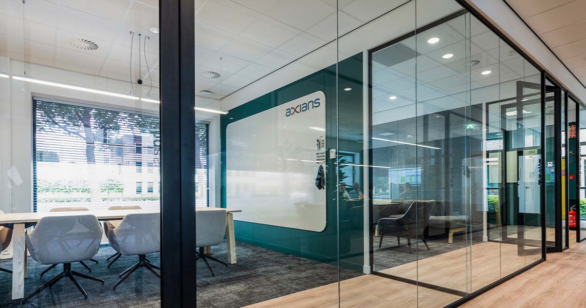 Whiteboard wall installed across an office wall