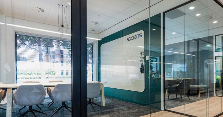 Whiteboard wall installed across an office wall