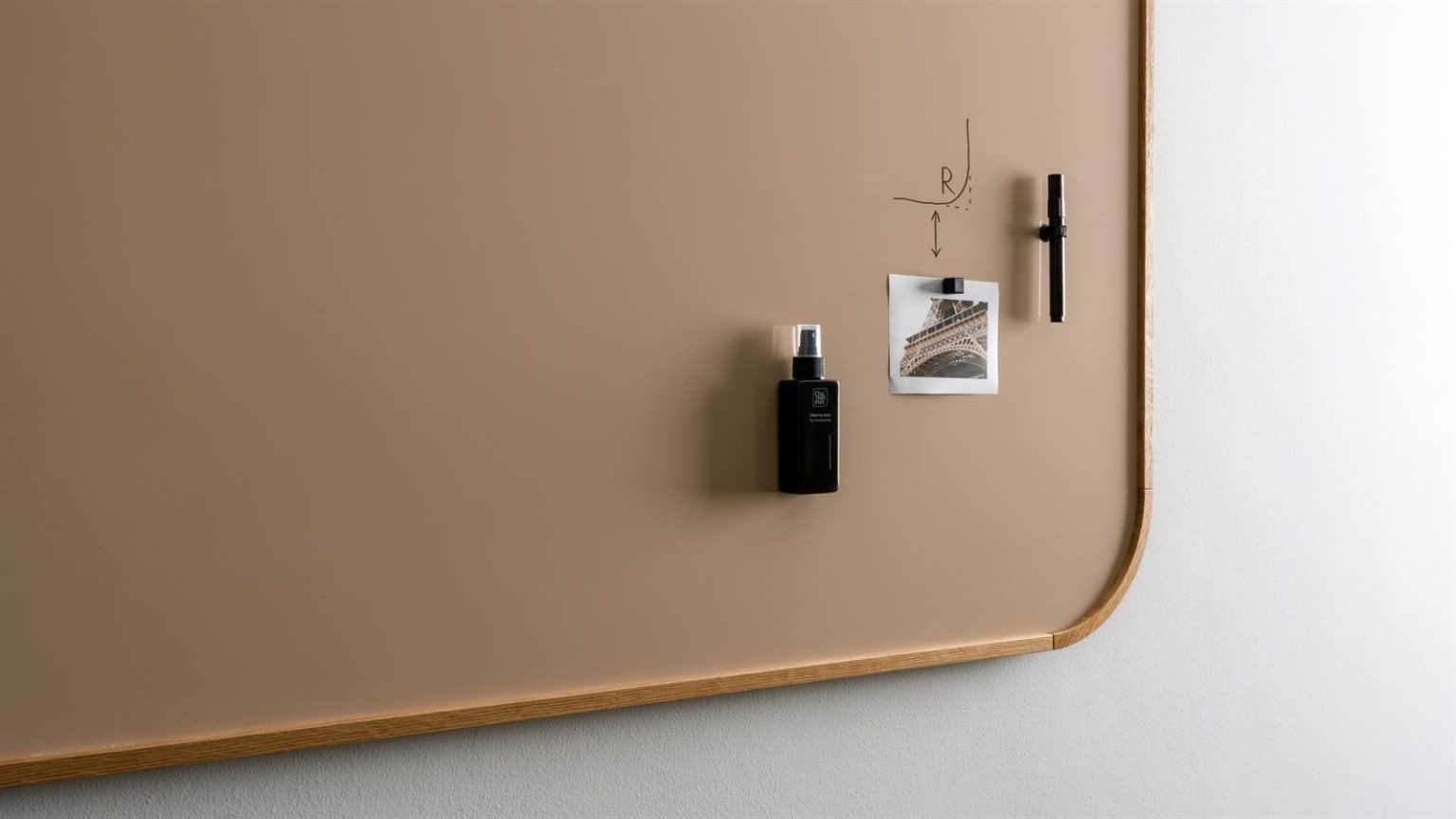 Zoomed-in detail of the rounded corner and accessories on the Chameleon Curve Oak whiteboard