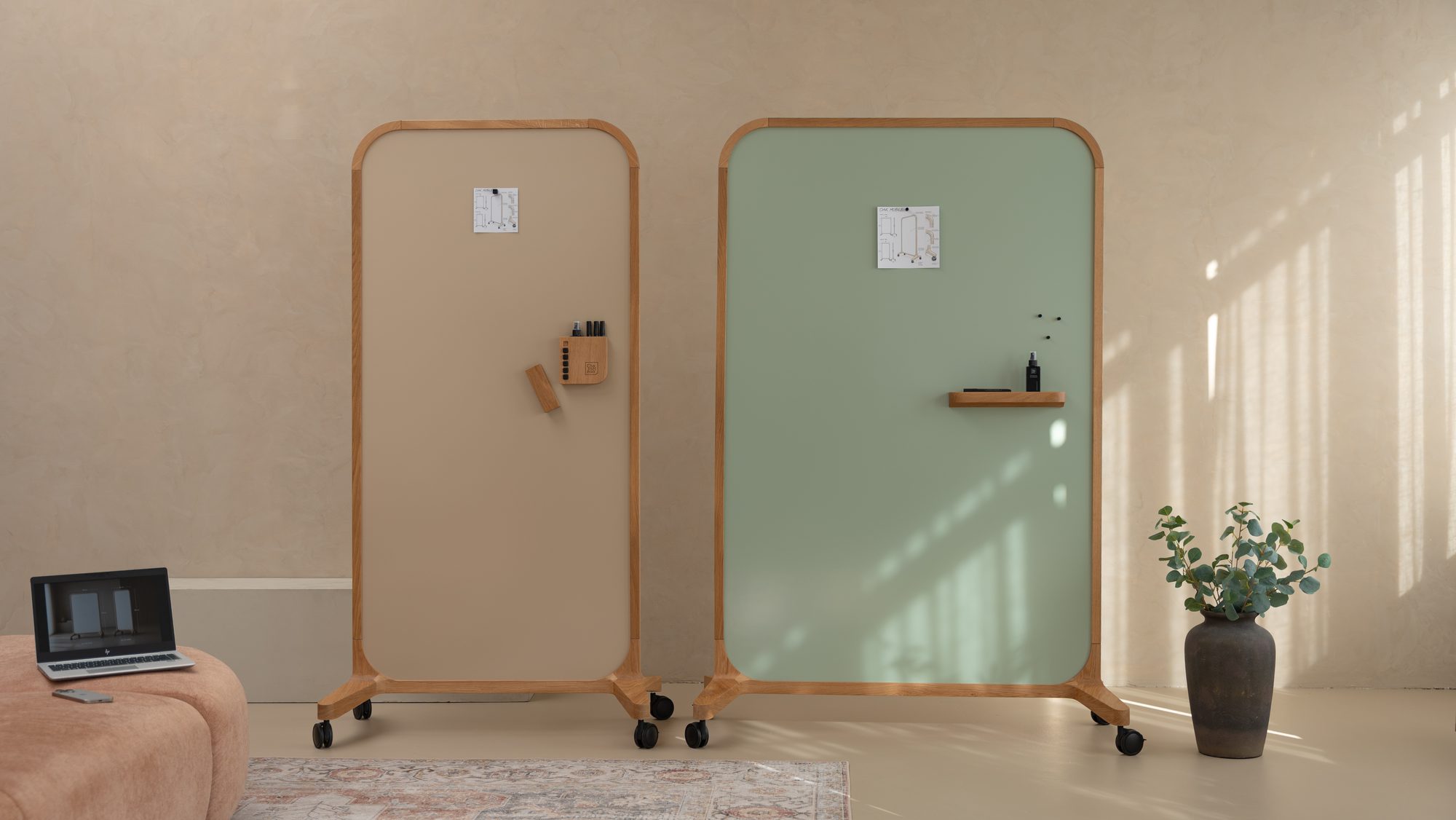 Two Oak Mobile whiteboards in beige and sage green in a lounge corner
